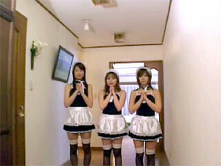 Three kinky Asian girls dressed as maids jerking a guy off